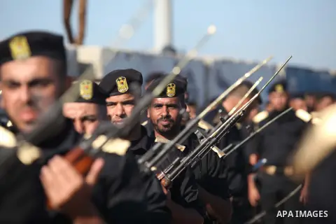 Members of Palestinian security forces march during a graduation ceremony in Gaza City December 4, 2014. Photo by Ashraf Amra