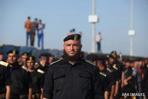 Members of Palestinian security forces march during a graduation ceremony in Gaza City December 4, 2014. Photo by Ashraf Amra