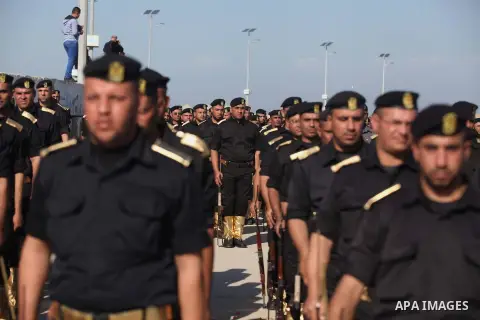 Members of Palestinian security forces march during a graduation ceremony in Gaza City December 4, 2014. Photo by Ashraf Amra