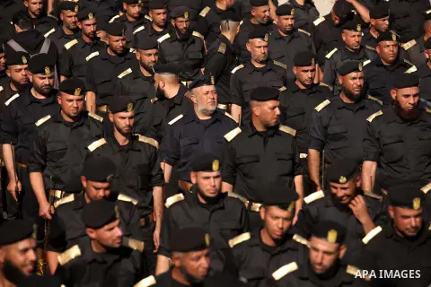 Members of Palestinian security forces march during a graduation ceremony in Gaza City December 4, 2014. Photo by Ashraf Amra