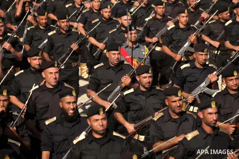 Members of Palestinian security forces march during a graduation ceremony in Gaza City December 4, 2014. Photo by Ashraf Amra