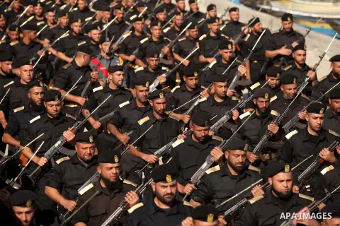 Members of Palestinian security forces march during a graduation ceremony in Gaza City December 4, 2014. Photo by Ashraf Amra