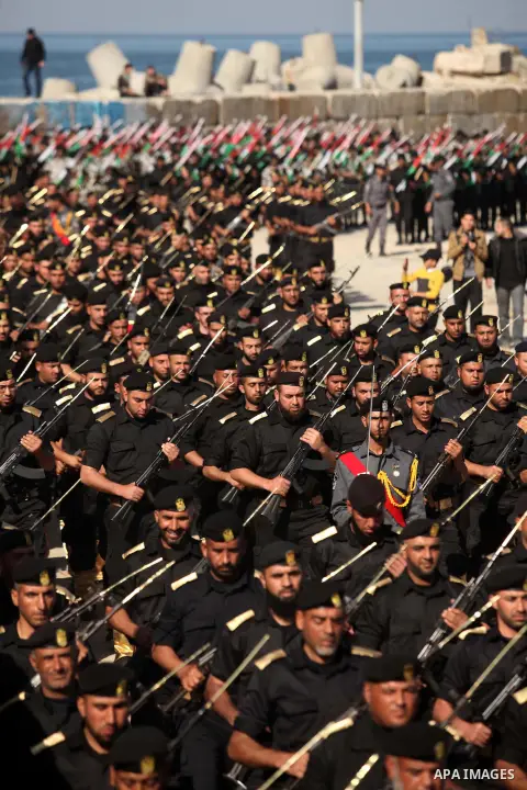 Members of Palestinian security forces march during a graduation ceremony in Gaza City December 4, 2014. Photo by Ashraf Amra