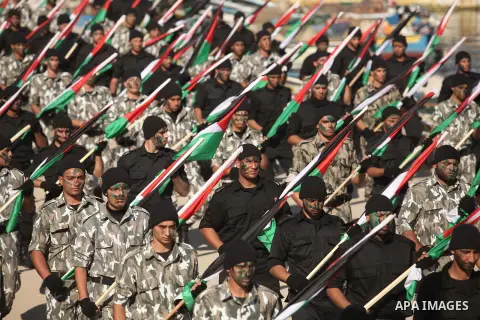 Members of Palestinian security forces march during a graduation ceremony in Gaza City December 4, 2014. Photo by Ashraf Amra