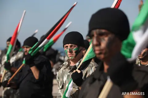 Members of Palestinian security forces march during a graduation ceremony in Gaza City December 4, 2014. Photo by Ashraf Amra