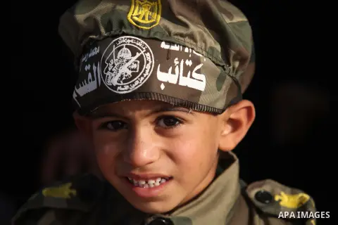 Palestinians attend a graduation ceremony for Members of Palestinian security forces in Gaza City December 4, 2014. Photo by Ashraf Amra