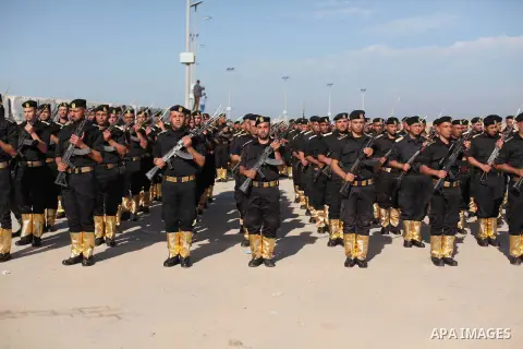 Members of Palestinian security forces march during a graduation ceremony in Gaza City December 4, 2014. Photo by Ashraf Amra