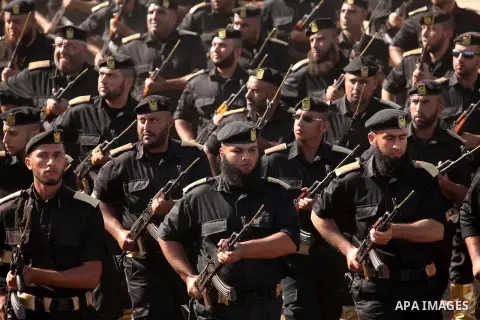 Members of Palestinian security forces march during a graduation ceremony in Gaza City December 4, 2014. Photo by Ashraf Amra