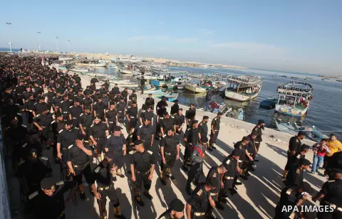 Members of Palestinian security forces march during a graduation ceremony in Gaza City December 4, 2014. Photo by Ashraf Amra