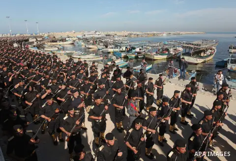 Members of Palestinian security forces march during a graduation ceremony in Gaza City December 4, 2014. Photo by Ashraf Amra