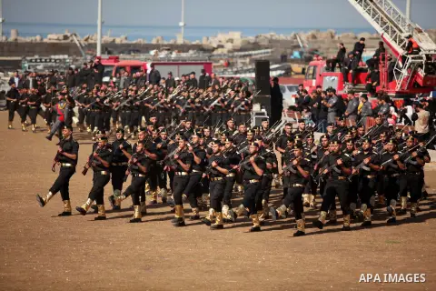 Members of Palestinian security forces march during a graduation ceremony in Gaza City December 4, 2014. Photo by Ashraf Amra