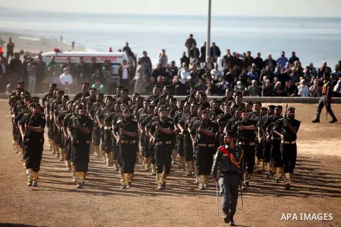 Members of Palestinian security forces march during a graduation ceremony in Gaza City December 4, 2014. Photo by Ashraf Amra