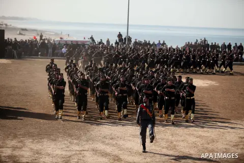 Members of Palestinian security forces march during a graduation ceremony in Gaza City December 4, 2014. Photo by Ashraf Amra