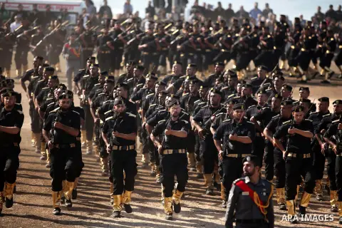 Members of Palestinian security forces march during a graduation ceremony in Gaza City December 4, 2014. Photo by Ashraf Amra