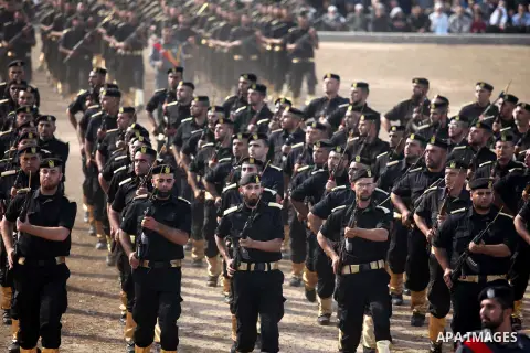 Members of Palestinian security forces march during a graduation ceremony in Gaza City December 4, 2014. Photo by Ashraf Amra