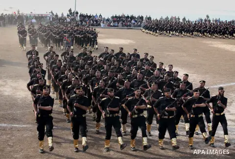 Members of Palestinian security forces march during a graduation ceremony in Gaza City December 4, 2014. Photo by Ashraf Amra