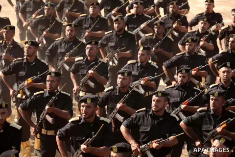 Members of Palestinian security forces march during a graduation ceremony in Gaza City December 4, 2014. Photo by Ashraf Amra