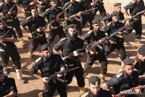 Members of Palestinian security forces march during a graduation ceremony in Gaza City December 4, 2014. Photo by Ashraf Amra