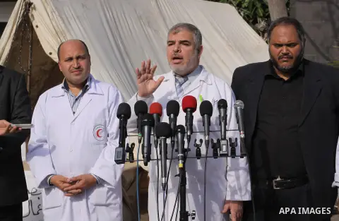 Director of Shifa Hospital, Nasser El-Tatar speaks during a press conference at al-shifa hospital as clean workers protest to demand for pay their salaries, in Gaza City December 4, 2014. Photo by Mohammed Asad