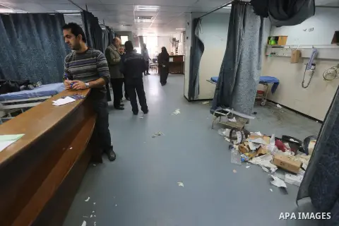 Palestinians wait at al-shifa hospital as clean workers protest to demand for pay their salaries, in Gaza City December 4, 2014. Photo by Mohammed Asad
