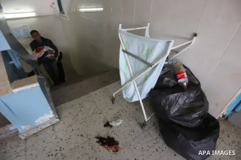 Palestinians wait at al-shifa hospital as clean workers protest to demand for pay their salaries, in Gaza City December 4, 2014. Photo by Mohammed Asad