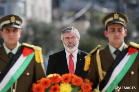 Sinn Fein leader Gerry Adams lays a wreath on the tomb of late Palestinian leader Yasser Arafat upon his arrival in the West Bank city of Ramallah on December 4, 2014. Photo by Shadi Hatem