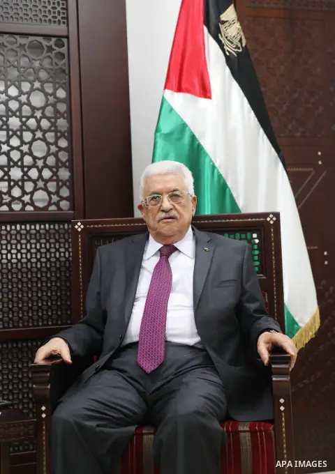 Palestinian President, Mahmoud Abbas, attends a meeting with Sinn Fein leader Gerry Adams in the West Bank city of Ramallah on December 4, 2014. Photo by Shadi Hatem