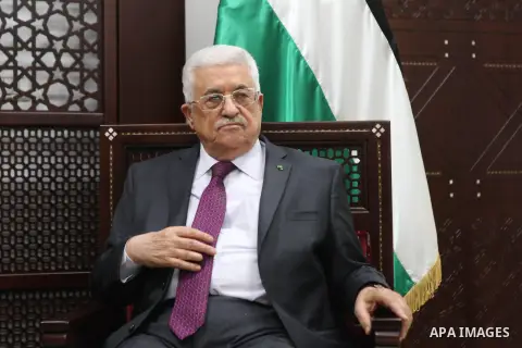 Palestinian President, Mahmoud Abbas, attends a meeting with Sinn Fein leader Gerry Adams in the West Bank city of Ramallah on December 4, 2014. Photo by Shadi Hatem