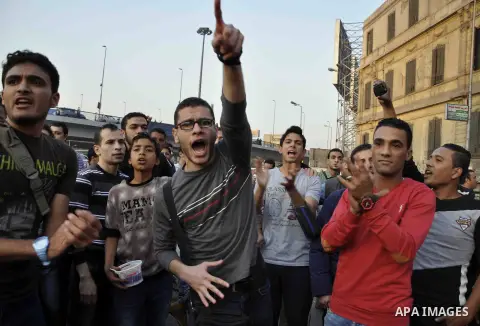 Egyptian protesters shout slogans on Abdel Moneim Riad Square in the capital Cairo on December 5, 2014, during a demonstration against a court's decision to drop a murder charge against ousted president Hosni Mubarak. A...