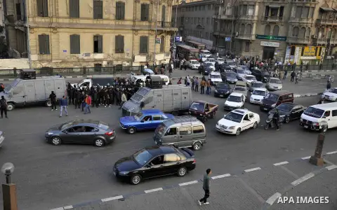 Egyptian police deploy on Abdel Moneim Riad Square in the capital Cairo on December 5, 2014, during a demonstration against a court's decision to drop a murder charge against ousted president Hosni Mubarak. A Cairo court...
