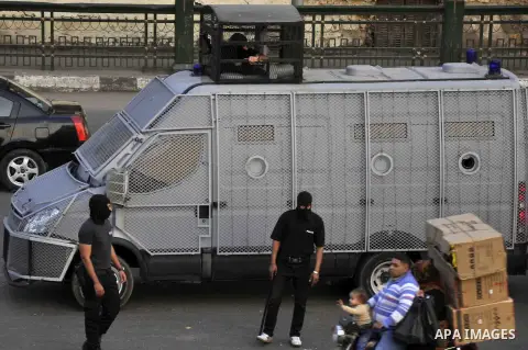 Egyptian police deploy on Abdel Moneim Riad Square in the capital Cairo on December 5, 2014, during a demonstration against a court's decision to drop a murder charge against ousted president Hosni Mubarak. A Cairo court...