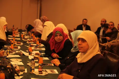 Palestinians attend a press conference of the union staff, in Gaza city, on December 6, 2014. Photo by Ashraf Amra