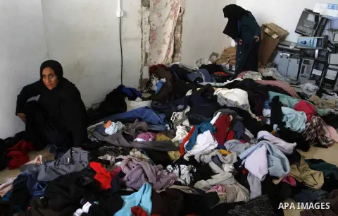 Palestinians looks at second hand clothes at a market in Rafah in the southern Gaza strip, December 06, 2014. Due to the current economic situation in Gaza Strip, many of the Palestinians resort to meet their needs of us...