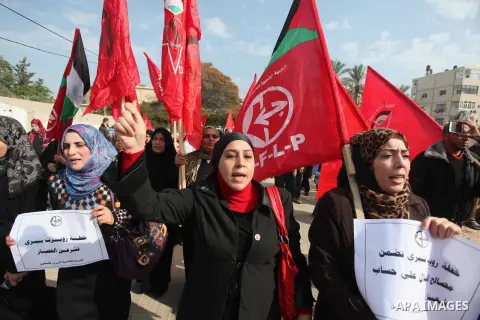 Palestinian supporters of the Popular Front for the Liberation of Palestine (PFLP) gather during a protest against the delay in acquiring building material in front of the United Nations office in Gaza city on December 7...