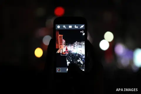 Palestinians celebrate the lighting of the Christmas tree, in the West Bank city of Ramallah, as preparations for Christmas celebrations get underway on December 7, 2014. Photo by Shadi Hatem
