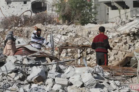 Palestinian workers extract iron from the rubbles of houses that witnesses said was destroyed by Israeli shelling during the most recent conflict between Israel and Hamas, in the east of Gaza City, December 10, 2014. Acc...