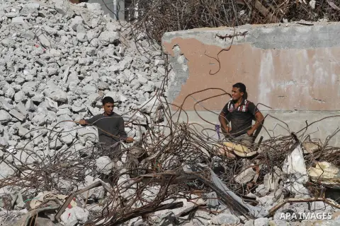 Palestinian workers extract iron from the rubbles of houses that witnesses said was destroyed by Israeli shelling during the most recent conflict between Israel and Hamas, in the east of Gaza City, December 10, 2014. Acc...