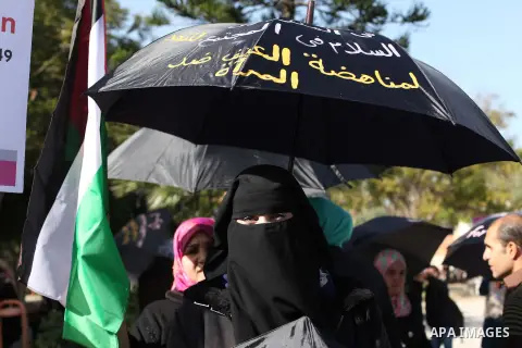 Palestinian women take part in a demonstration to mark the International Day of Human Rights, in Gaza City on December 10, 2014. The Palestinians are seeking a UN resolution by year-end that would set a timetable for Isr...