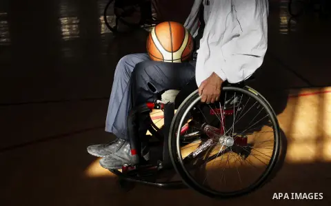 A disabled Palestinian man takes part in a basketball match during a championship organised by the Palestinian Red Cross to mark the International Day of Human Rights, in Khan Younis in the southern Gaza Strip, on Decemb...