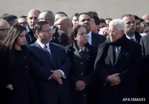 Palestinian President Mahmoud Abbas attends the funeral of Palestinian minister Ziad Abu Ein in the West Bank city of Ramallah on December 11, 2014. Thousands of Palestinians gathered to mourn Abu Ein who died in a confr...
