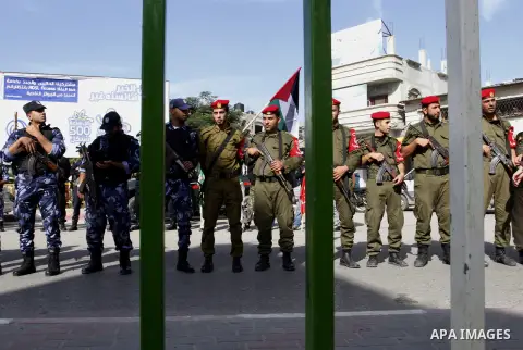 Members Palestinian security forces take part in a rally in solidarity with al-Aqsa mosque in Jerusalem, in Rafah in the southern Gaza Strip, December 11, 2014. Photo by Abed Rahim Khatib