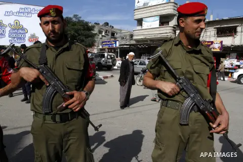 Members Palestinian security forces take part in a rally in solidarity with al-Aqsa mosque in Jerusalem, in Rafah in the southern Gaza Strip, December 11, 2014. Photo by Abed Rahim Khatib