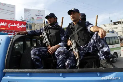 Members Palestinian security forces take part in a rally in solidarity with al-Aqsa mosque in Jerusalem, in Rafah in the southern Gaza Strip, December 11, 2014. Photo by Abed Rahim Khatib