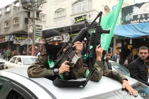 Palestinians Hamas supporters take part in a rally ahead of the 27th anniversary of the movement founding, in Jabaliya in the northern Gaza Strip December 12, 2014. Photo by Ashraf Amra