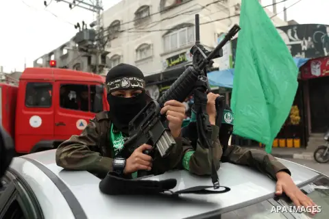 Palestinians Hamas supporters take part in a rally ahead of the 27th anniversary of the movement founding, in Jabaliya in the northern Gaza Strip December 12, 2014. Photo by Ashraf Amra