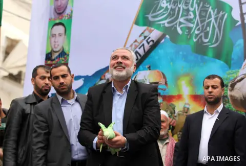 Senior Hamas leader Ismail Haniyeh, takes part in a rally ahead of the 27th anniversary of the movement founding, in Jabaliya in the northern Gaza Strip December 12, 2014. Photo by Ashraf Amra