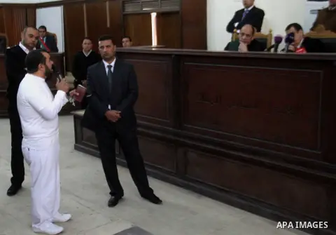 Judge Mohammed Nagui attends during the Muslim Brotherhood's trial at the court in Cairo December 13, 2014. Resumption of trial of Muslim Brotherhood Supreme Guide Mohamed Badie and 50 others in the case of the Rabaa ope...