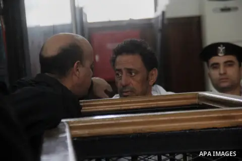 Egyptian lawyers attend the trial of Egyptian members of Muslim Brotherhood in the capital Cairo on December 13, 2014. Resumption of trial of Muslim Brotherhood Supreme Guide Mohamed Badie and 50 others in the case of th...