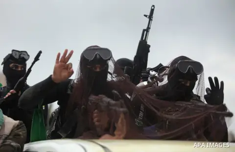 Palestinian members of the marine unit of al-Qassam Brigades, the armed wing of the Hamas movement, ride in a pickup truck as they take part in a military parade marking the 27th anniversary of Hamas' founding, in Gaza C...