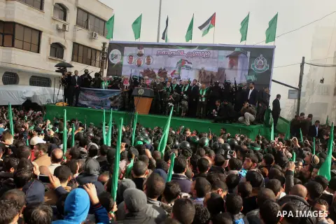 Hamas top leader in the Gaza Strip Ismail Haniya and Mussa Abu Marzuq attend a rally marking the 27th anniversary of Hamas' founding, in Gaza City December 14, 2014. Photo by Ashraf Amra
